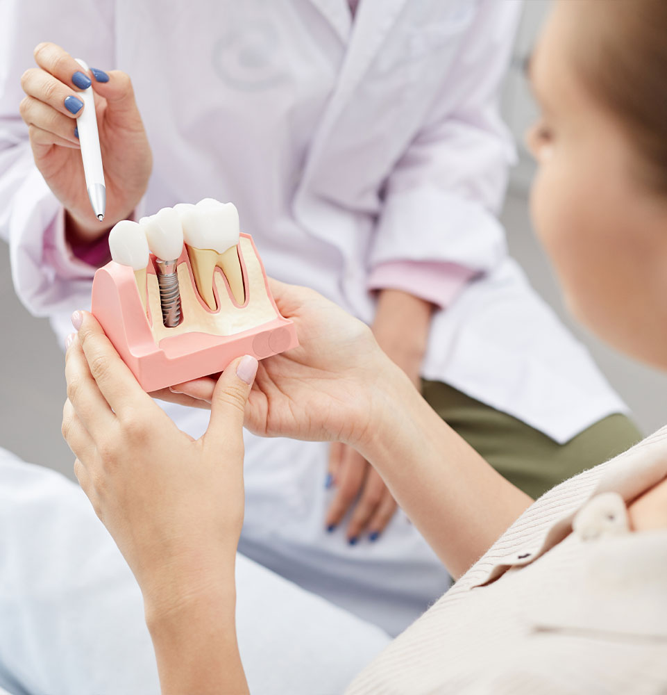dentist explaining dental implant procedure to patient