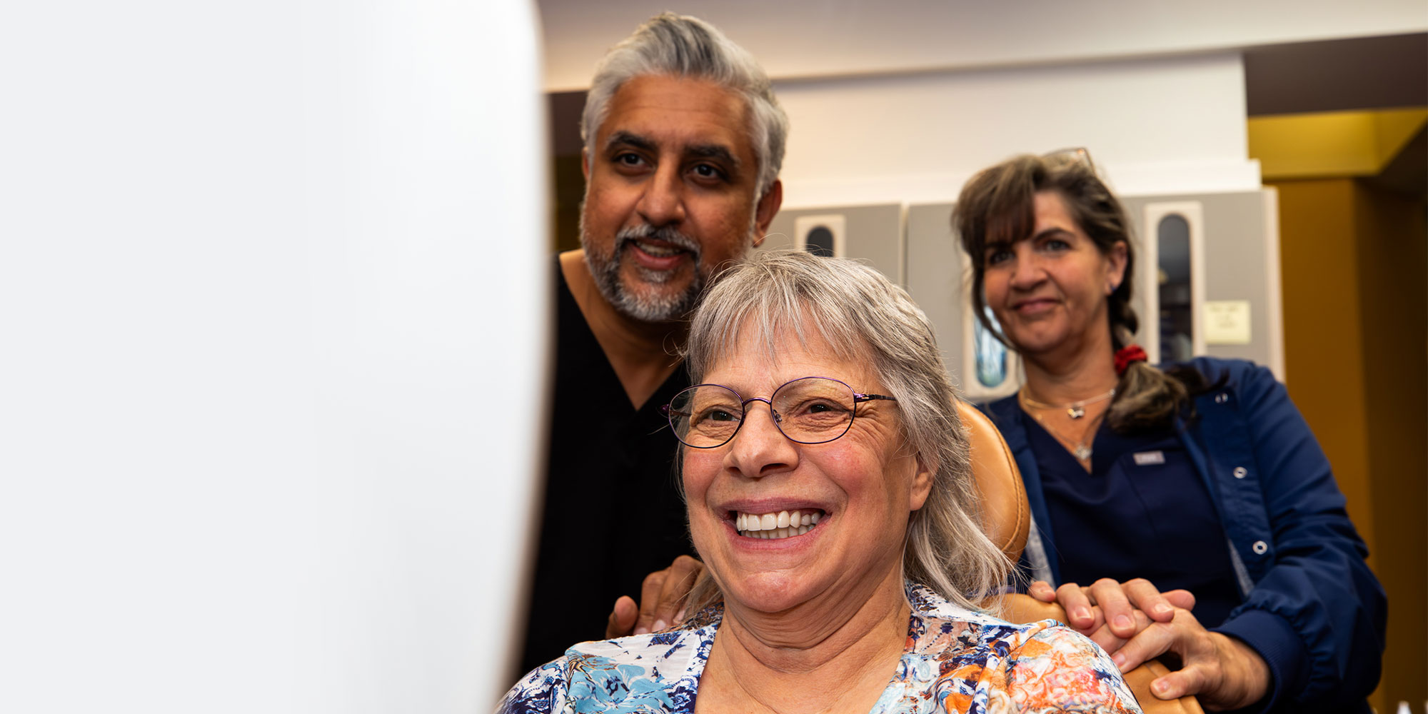 patient smiling after their dental procedure within the dental practice