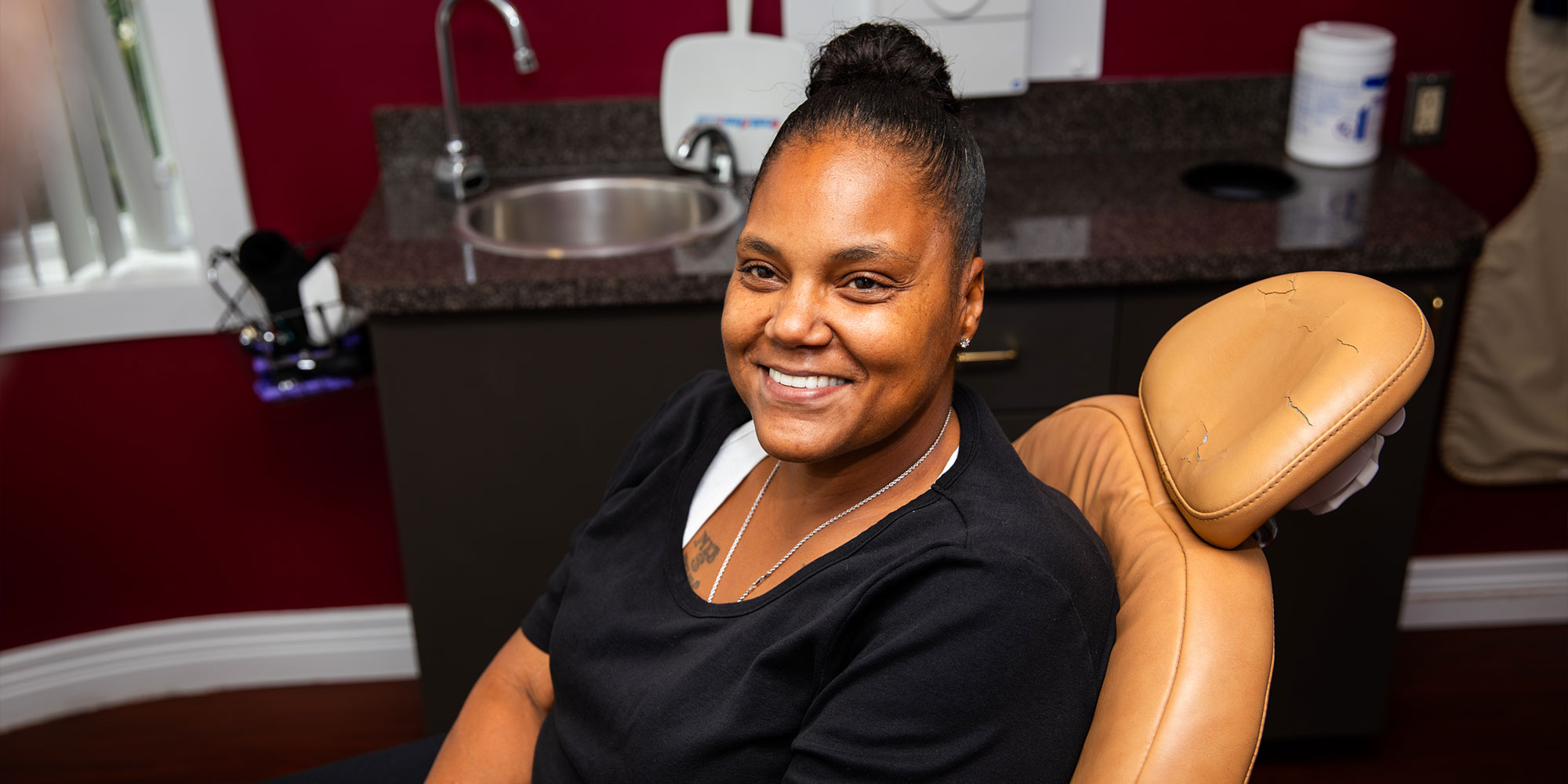 patient smiling after their dental procedure within the dental practice